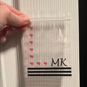 21ct Clear Baggie with Pink Heart Accents and Black Stripe MK accent.
